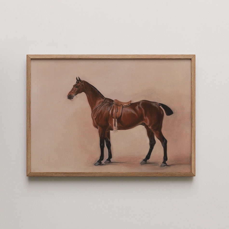 Framed painting of a brown horse standing with a saddle on a neutral background