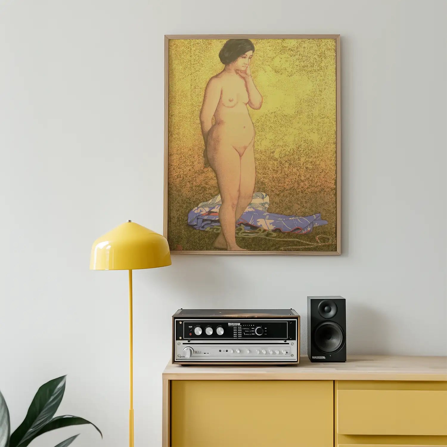 A vibrant painting of a nude woman standing thoughtfully against a textured gold background, framed above a stylish retro audio setup and a modern yellow lamp.