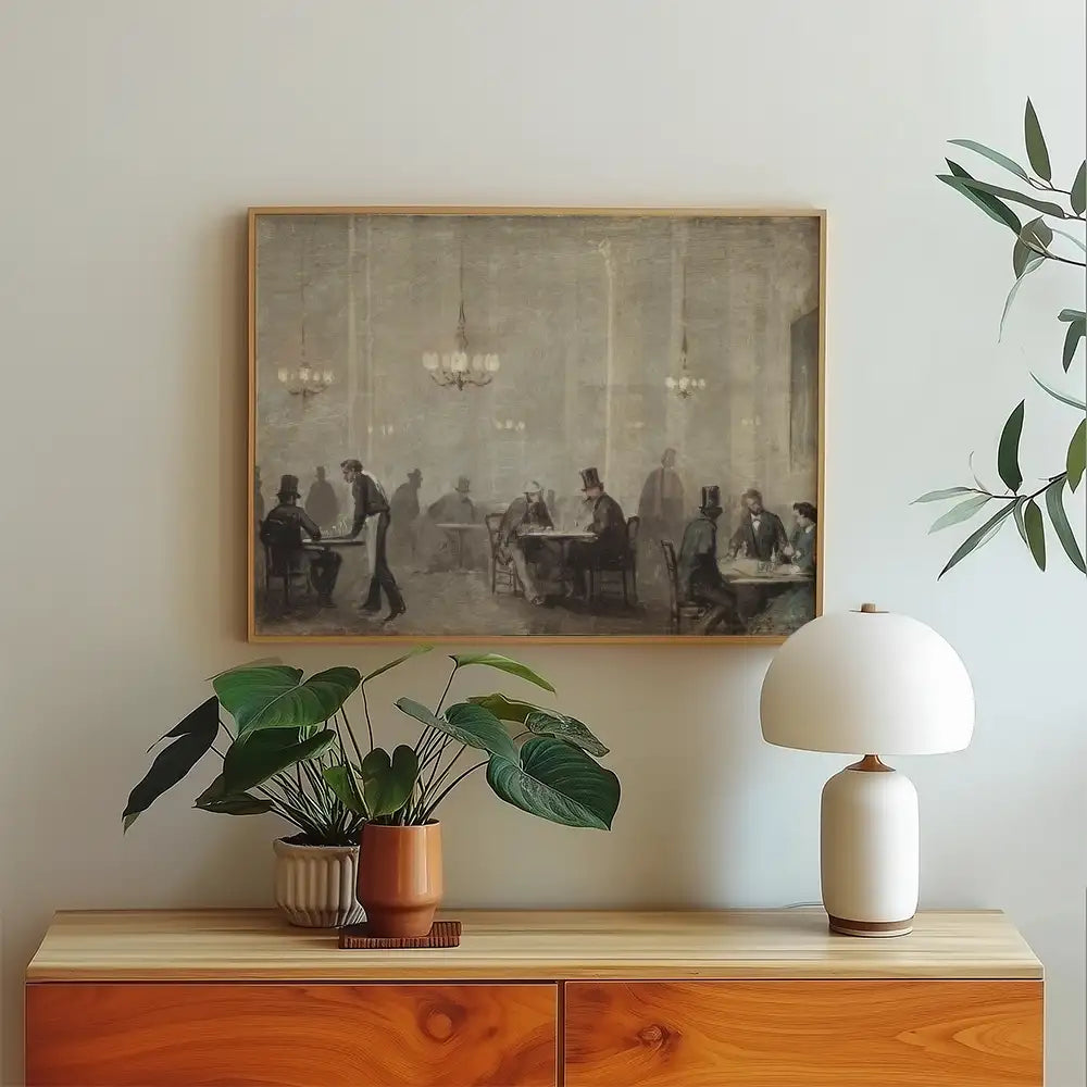 A vintage painting of a social gathering in a softly illuminated room, featuring elegantly dressed men seated at tables, framed and displayed above a wooden console with a potted plant and lamp.