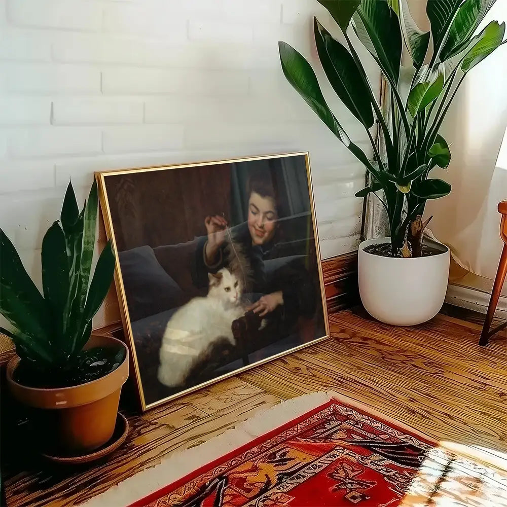 Framed painting of a young person playing with a white cat, surrounded by indoor plants.