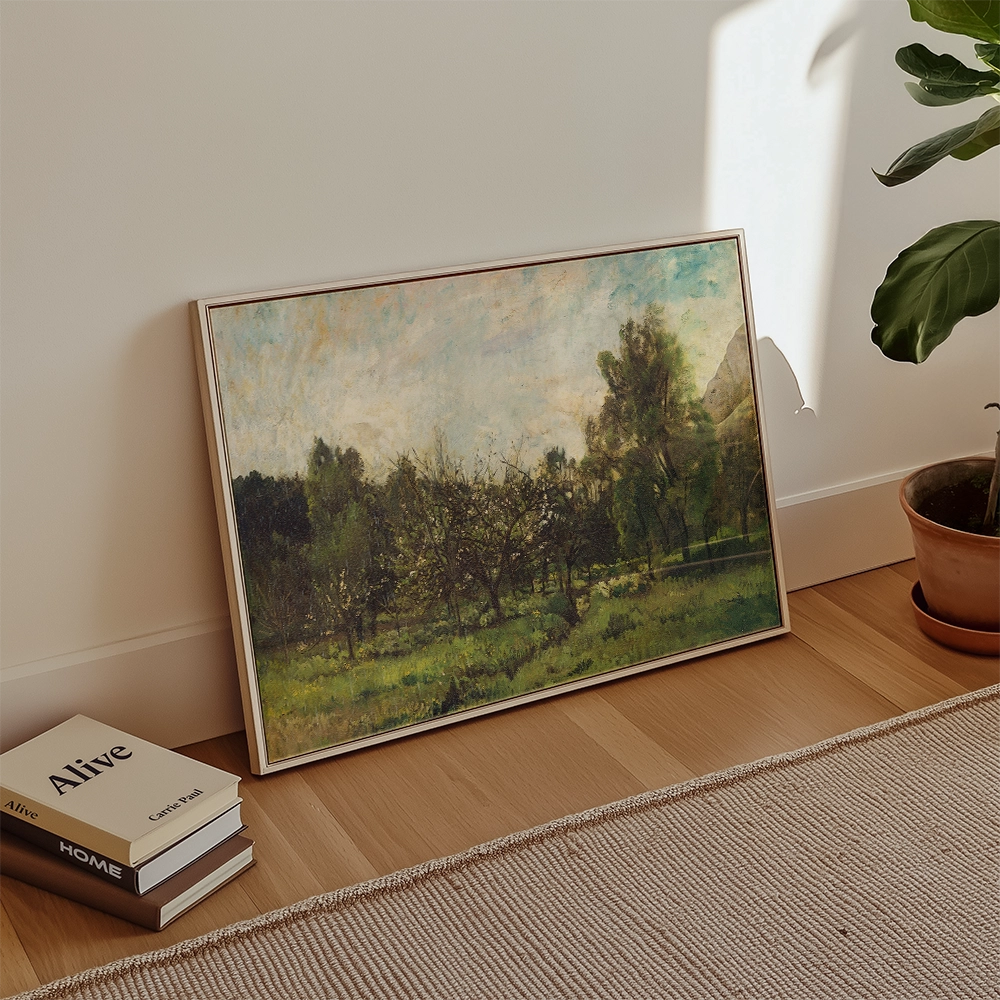 Framed painting of a lush orchard landscape displayed near houseplants and books on the floor.