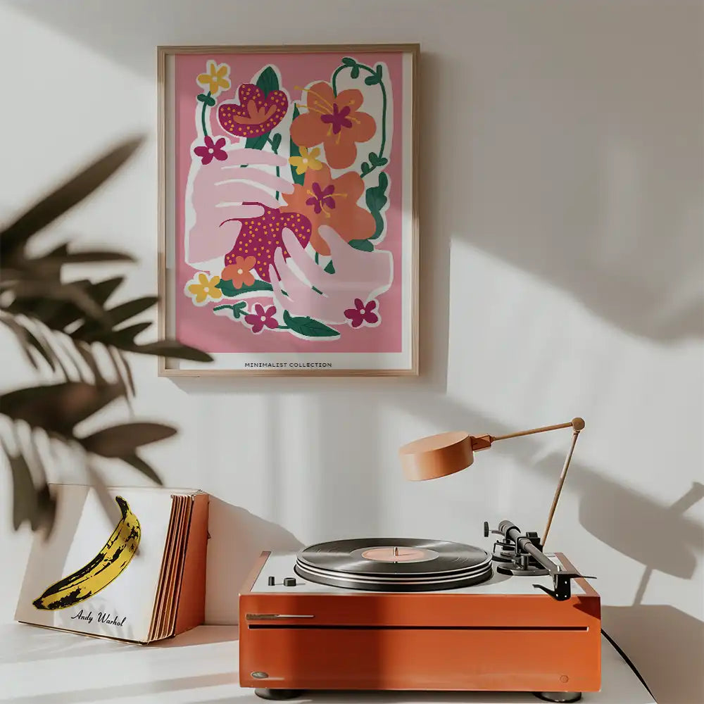 Modern poster featuring abstract floral design and hands, ideal for home decor, framed and displayed above a vintage record player.