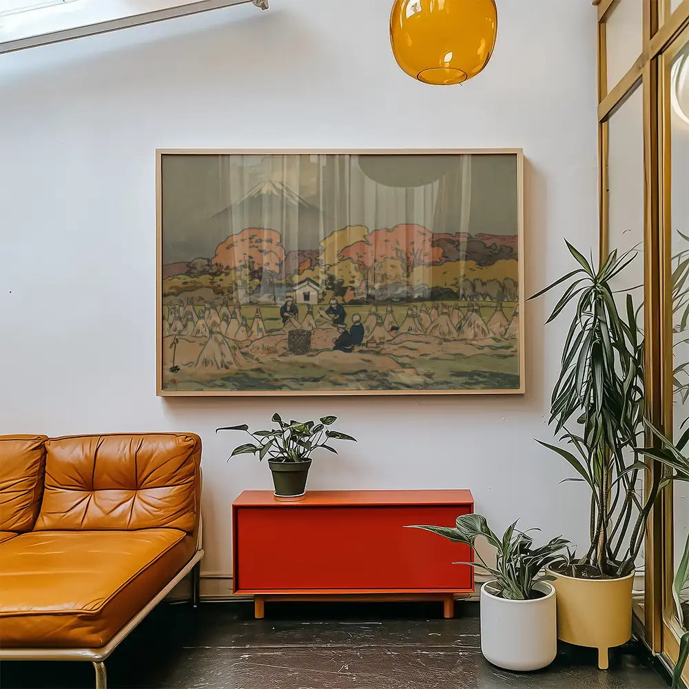 Framed painting depicting a serene landscape with figures, displayed in a modern living space with a leather sofa and potted plants.