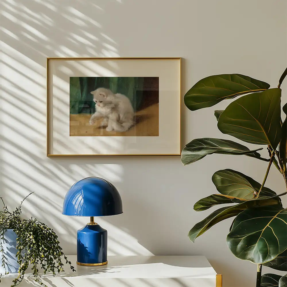 Framed painting of a fluffy white cat sitting on a wooden floor, displayed on a wall alongside a blue lamp and indoor plant.