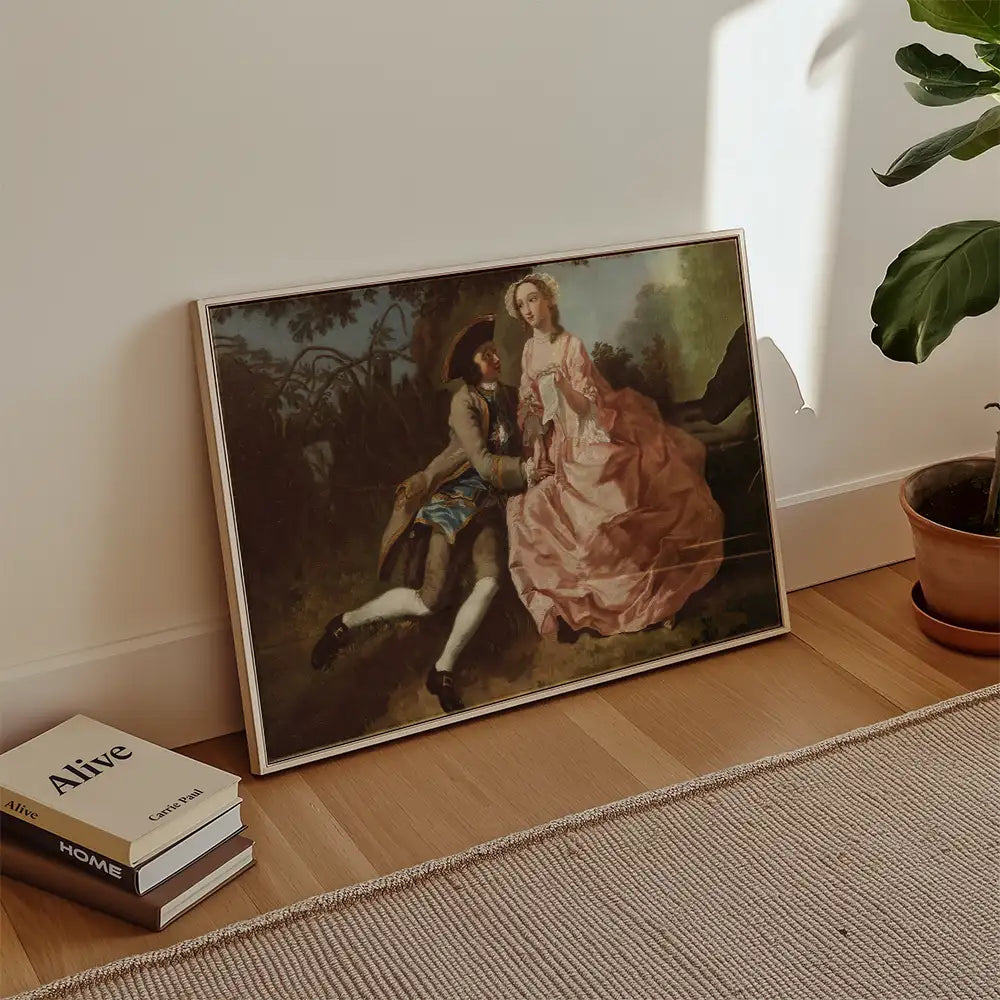Framed painting of a romantic scene with a man in historical attire and a woman in a pink dress, leaning against a wall with potted plant and books nearby.