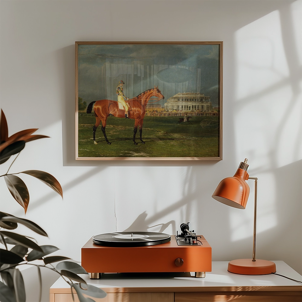 Painting of a horse and rider displayed in a modern interior setting with an orange turntable and lamp.