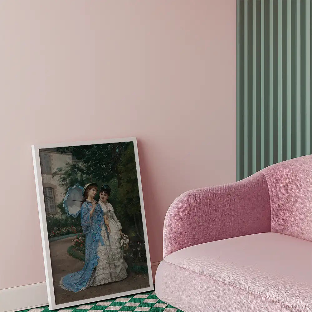Painting of two women in elegant dresses, framed and leaning against a wall in a modern interior with pink and green accents.