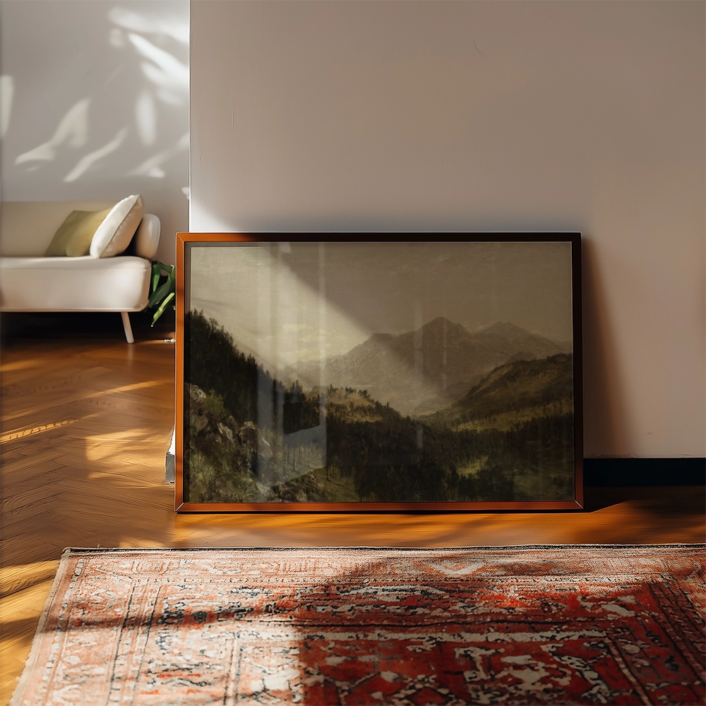 Framed landscape painting featuring mountains and forests, displayed against an interior wall with soft lighting.