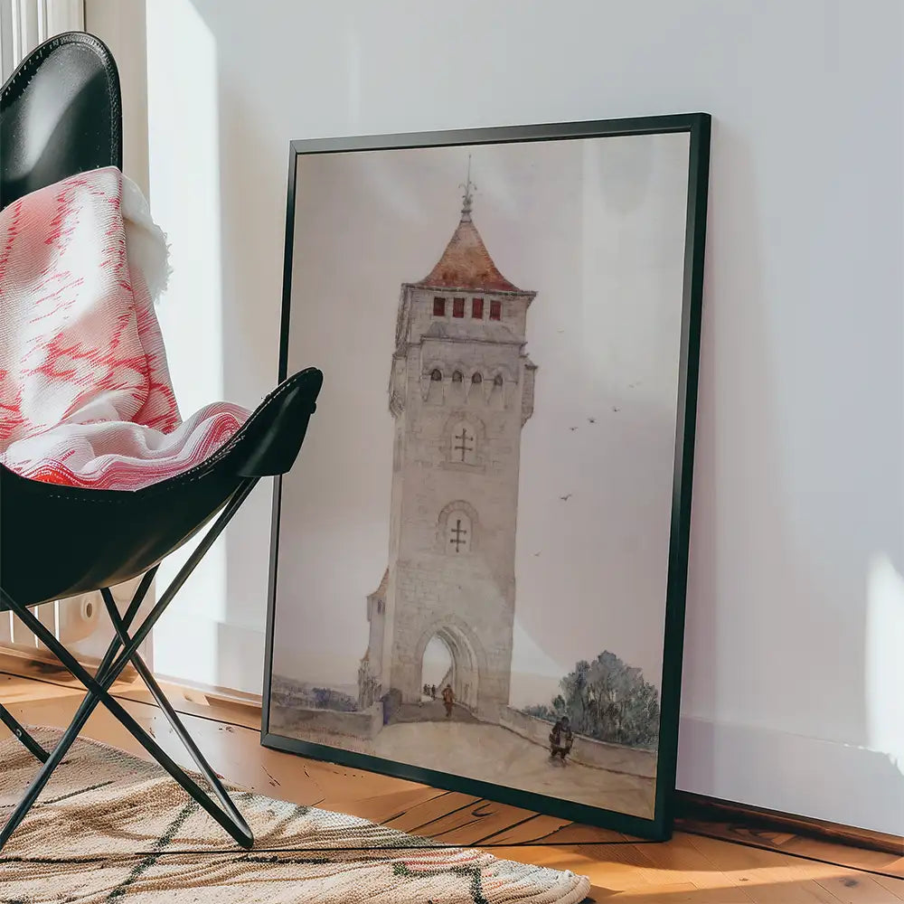 Framed painting of an old tower with a red roof, leaning against a wall, beside a black chair and a woven rug.