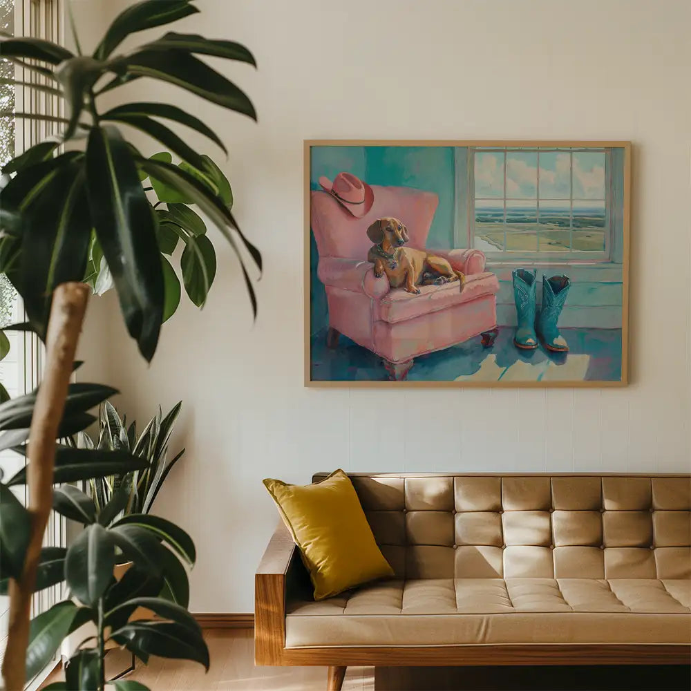 Modern reprint of a famous painting featuring a dog lounging on a pink chair with cowboy boots and a hat, displayed in a stylish living room.