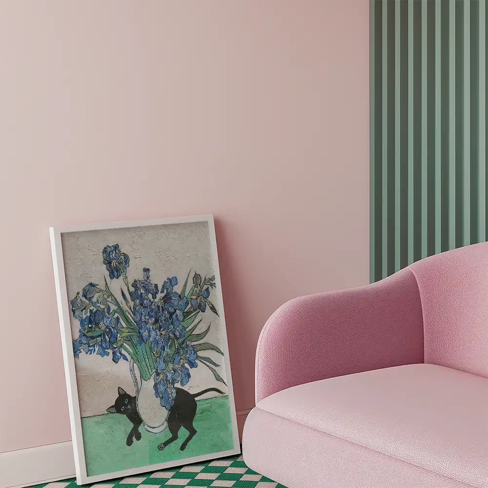 Painting of blue flowers in a vase with a black cat, displayed in a modern interior setting with pink walls and a pink sofa.