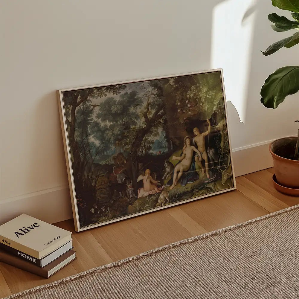Framed painting depicting a tranquil outdoor scene with figures among trees and animals, placed against a light-colored wall with potted plants and books nearby.