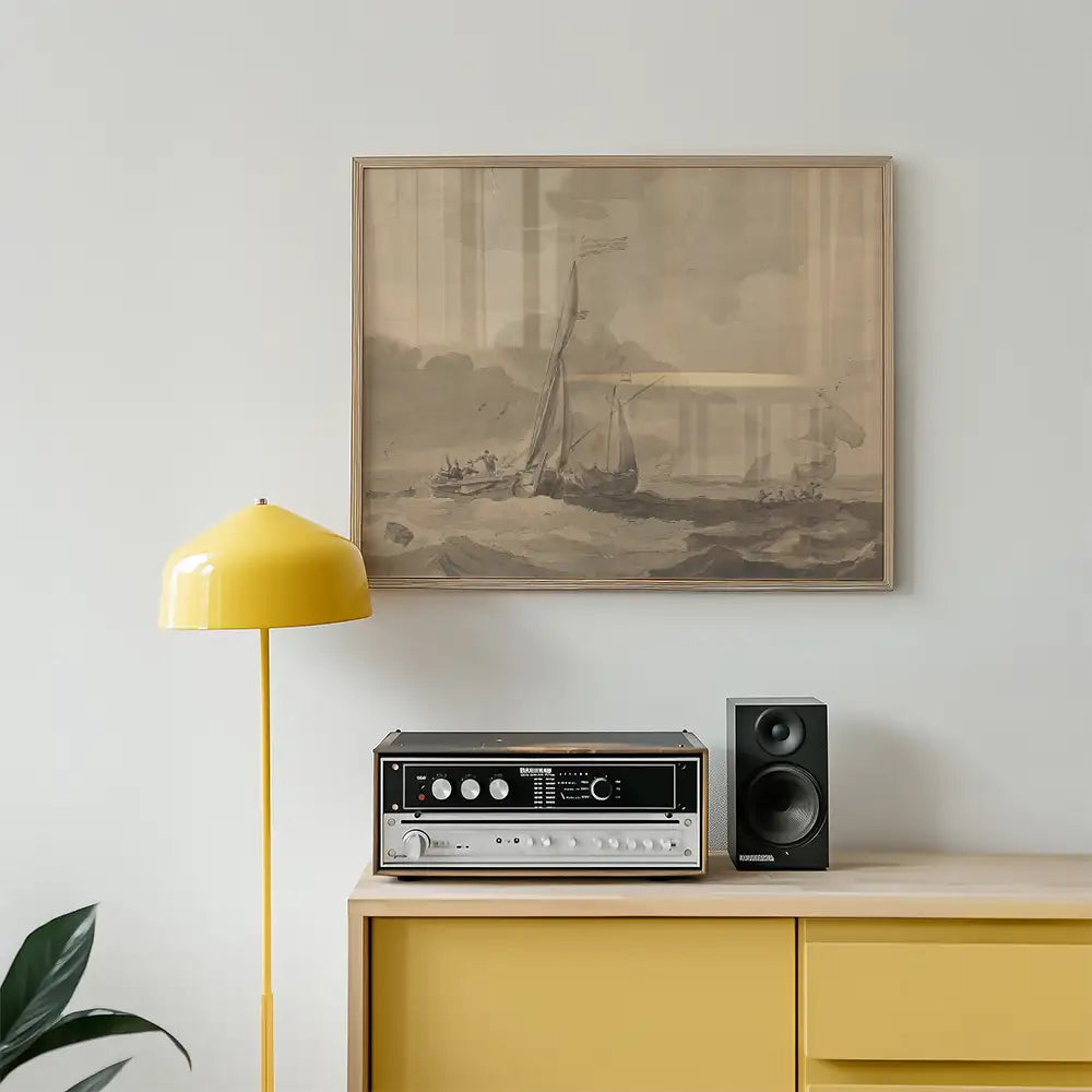 Framed vintage painting of sailing boats over a calm sea, displayed above a yellow lamp and a vintage audio system on a wooden sideboard.