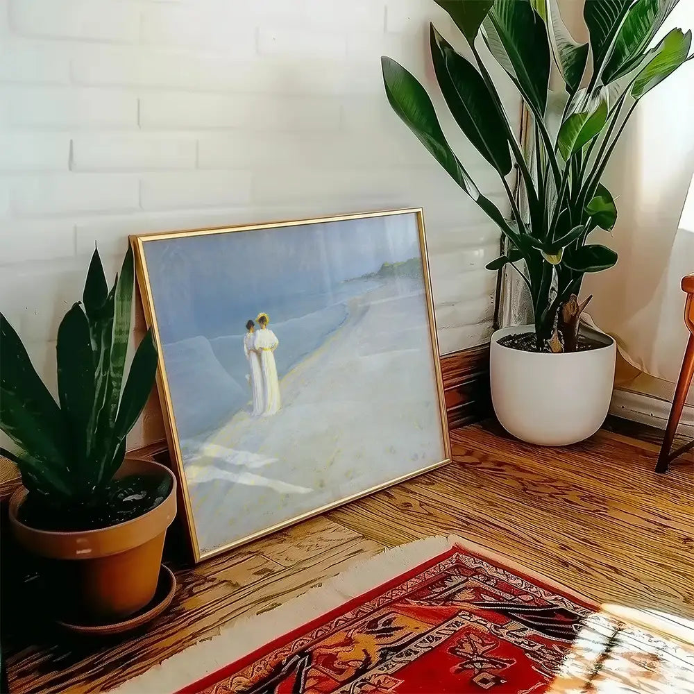 Framed painting of two figures on a beach, leaning against a wall with indoor plants and a decorative rug.