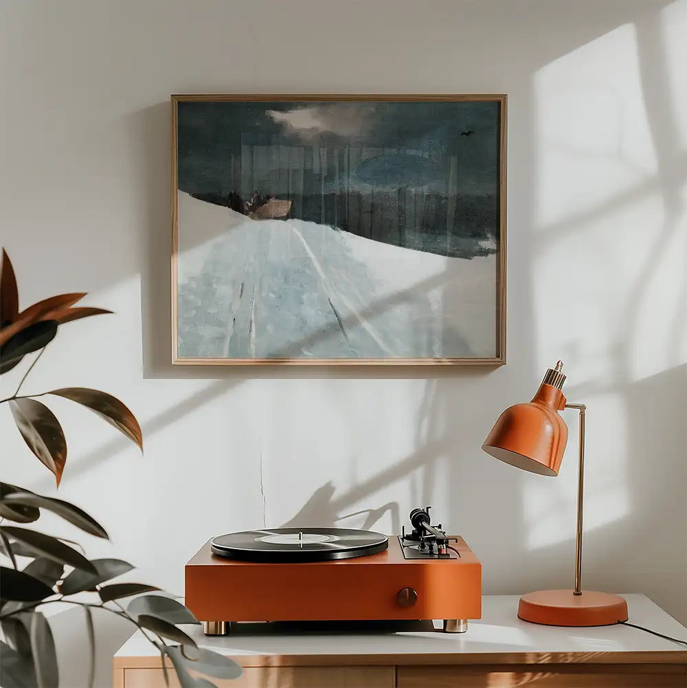 Painting of a tranquil winter landscape featuring soft blues and whites, framed and displayed above a vintage orange turntable and lamp in a cozy interior setting.