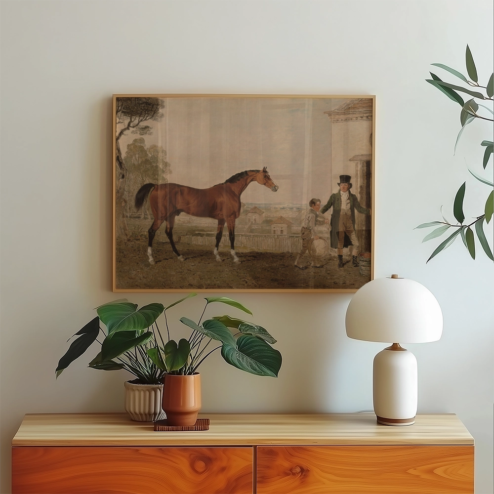 Painting of a horse with a boy and a man in formal attire, displayed in a modern interior setting with a wood cabinet, decorative plants, and a lamp.