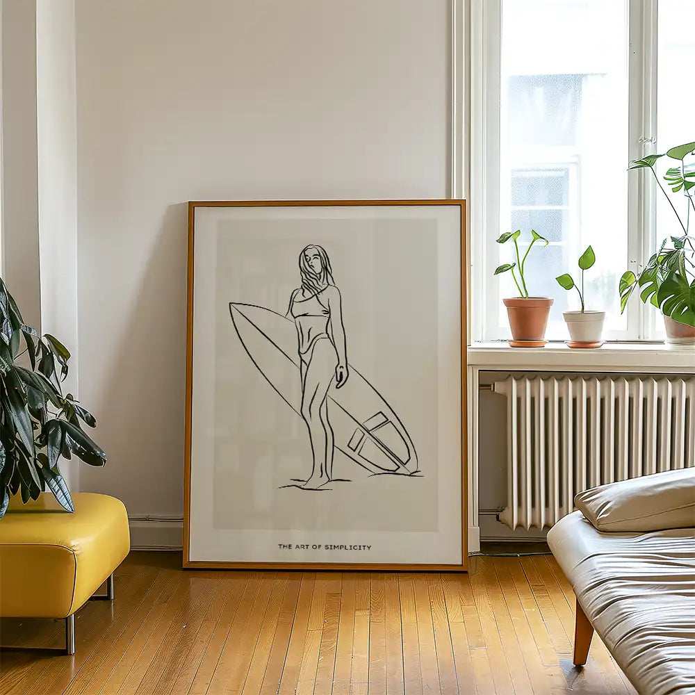 Modern poster reprint of a minimalist artwork featuring a woman holding a surfboard, titled "The Art of Simplicity," displayed in a stylish interior.