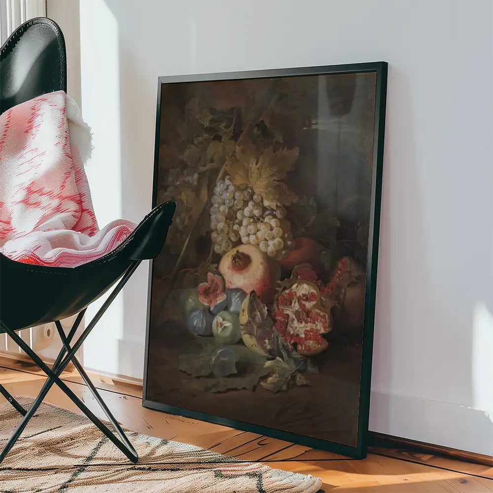Still life painting of assorted fruits including grapes, pomegranates, and other colorful produce, displayed near a black chair and a patterned rug.