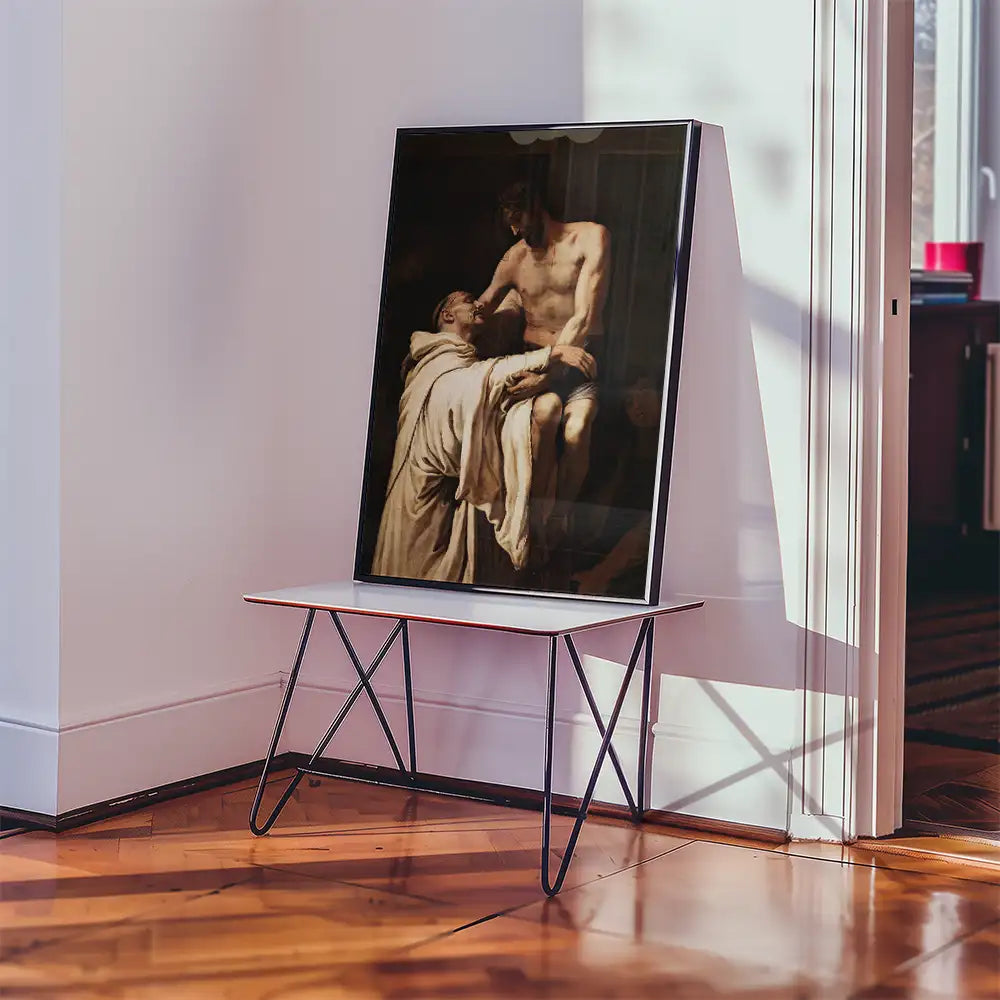 Framed painting of two figures in a dramatic pose displayed on a minimalist table in a sunlit room.