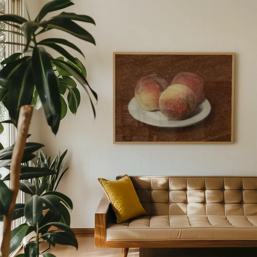 Painting of three peaches on a plate displayed on a wall in a cozy living room setting with a plant and a beige sofa.