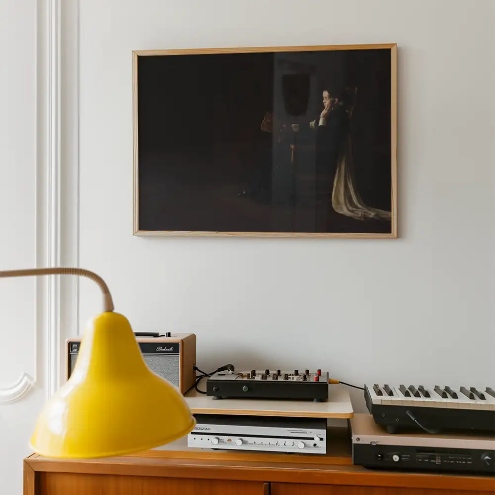 Painting displayed on a wall above a wooden sideboard with a yellow lamp and audio equipment.
