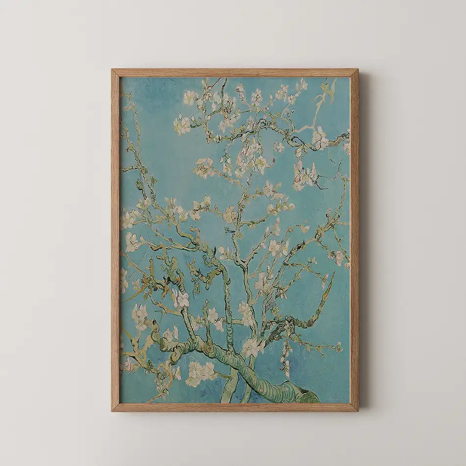 A framed painting of blossoming branches against a turquoise background.
