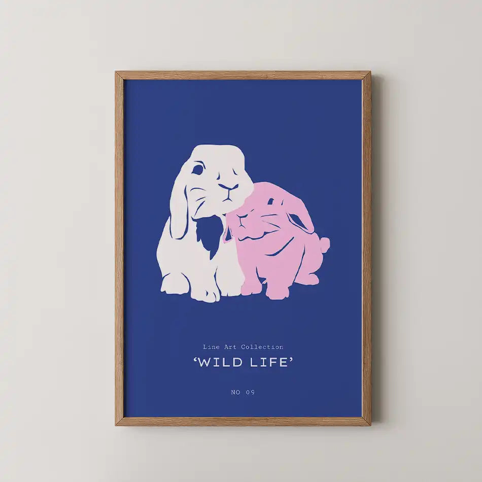 Charming minimalist rabbit art print featuring two cuddly bunnies in soft pink and gentle white shades, snuggling against a vibrant navy blue background, perfect for adding a whimsical touch to your home decor.
