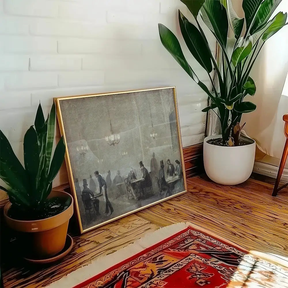 Framed vintage painting depicting a social gathering, positioned near indoor plants on a wooden floor.