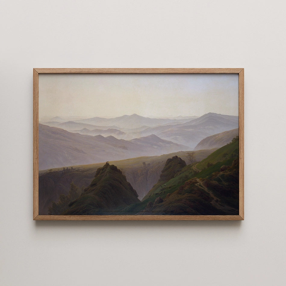 Framed painting of rolling green hills and mountains under a soft pastel sky.