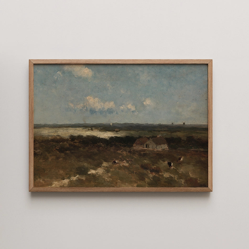 Landscape painting framed in wood, featuring a serene view with two houses, grassy fields, and a sky with scattered clouds.