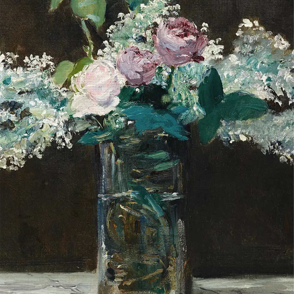 A glass vase filled with pink roses and delicate white flowers against a dark background.