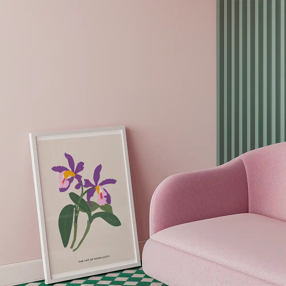 Modern floral poster featuring purple orchids, framed against a stylish interior with a pink wall and pink furniture, emphasizing simplicity and elegance.