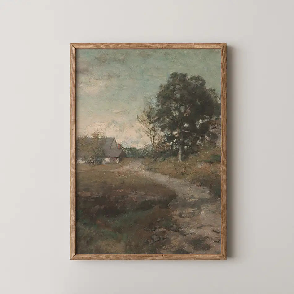 A framed painting of a landscape featuring a dirt path, a small house, and trees under a cloudy sky.