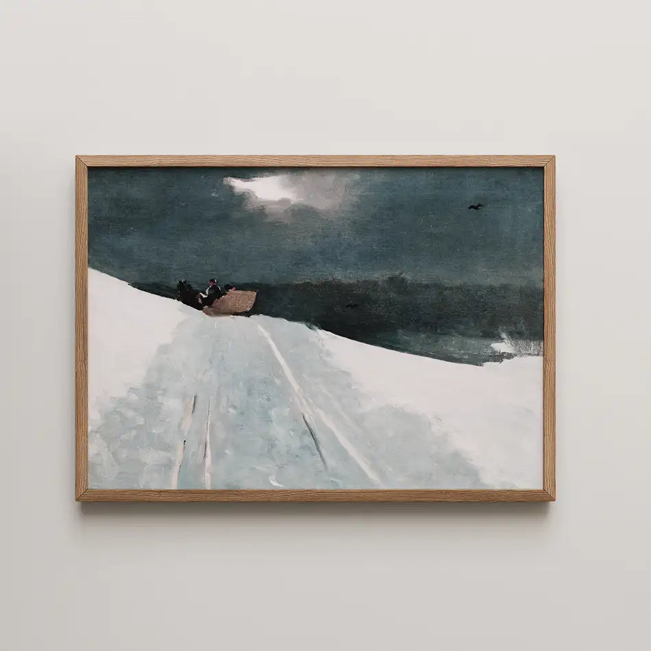 A winter landscape painting featuring a figure in a sled on a snowy path under a dark sky, framed in light wood.
