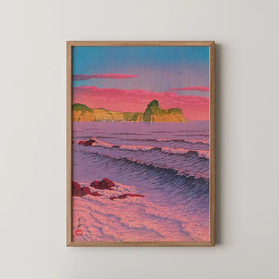 Sunset seascape painting with waves and cliffs in a wooden frame.