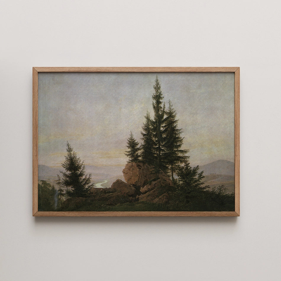 Framed painting of a serene landscape featuring tall pine trees on a rocky outcrop with a river winding through distant hills during sunset.