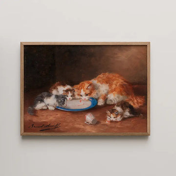 Painting of three kittens eating from a blue plate with a small overturned cup beside them, framed in light wood.