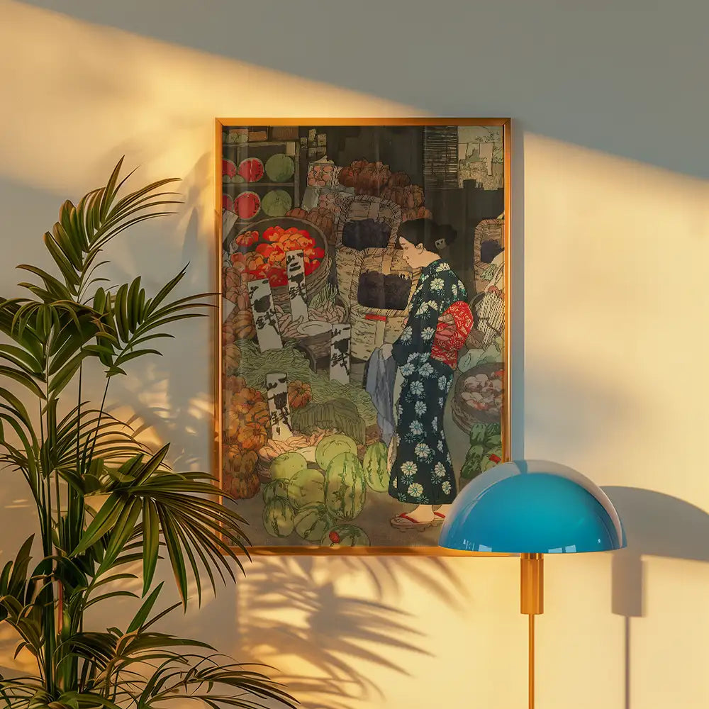 Painting of a woman in a traditional kimono standing in a vibrant market filled with colorful fruits and vegetables, framed and displayed on a wall beside a green plant and a blue lamp.