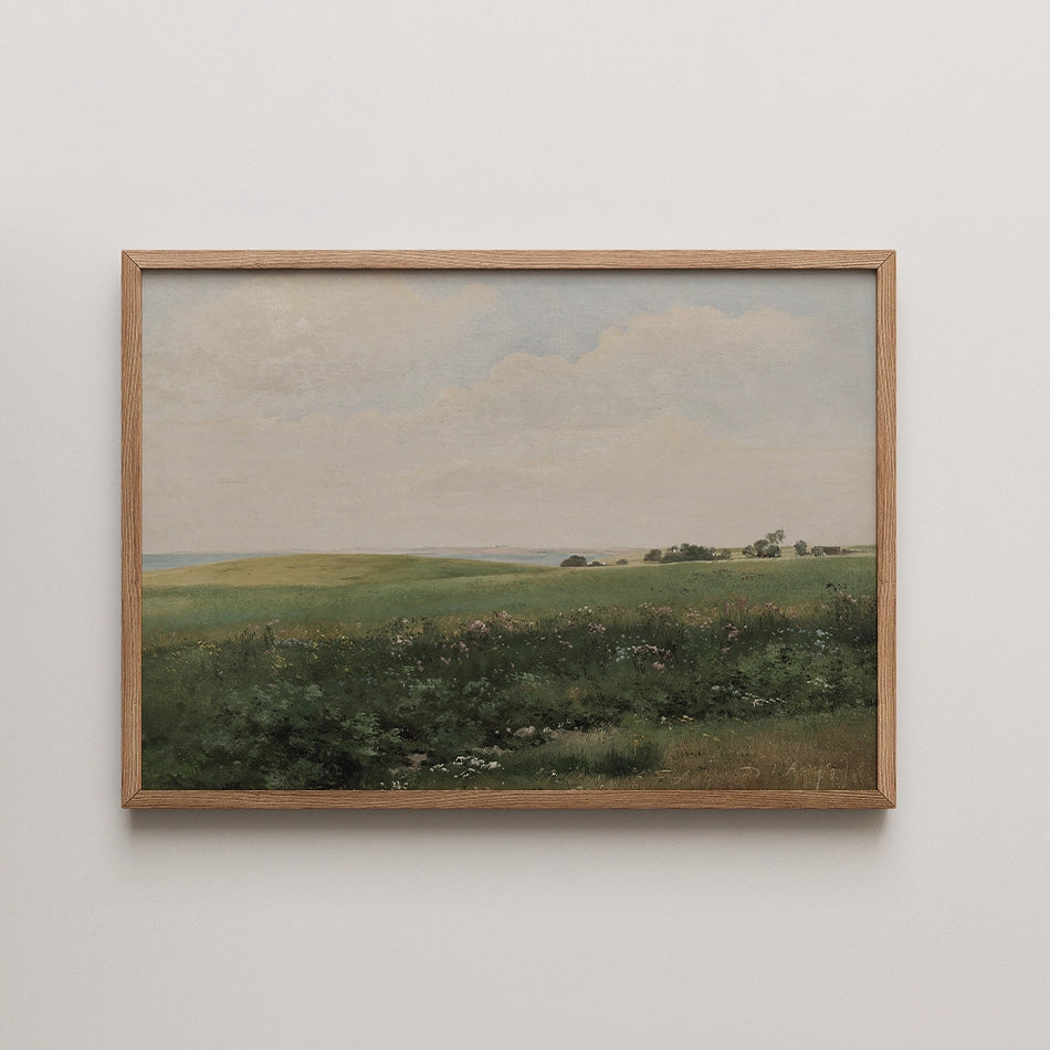 Framed painting of a serene green landscape with rolling hills under a cloudy sky.