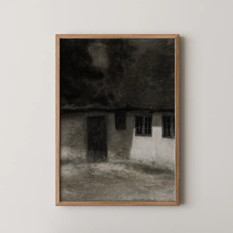 Framed painting of a dark, moody house with textured walls and windows, set against a neutral background.