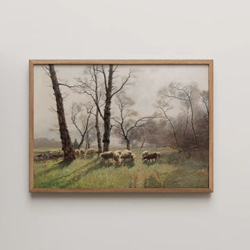 Painting of a pastoral landscape featuring sheep grazing among trees, framed in wood.