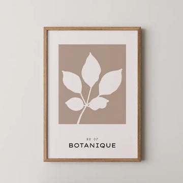 Minimalist art print of a white leaf silhouette on a beige background with modern typography reading 'BOTANIQUE' from the Bohemian Collection"