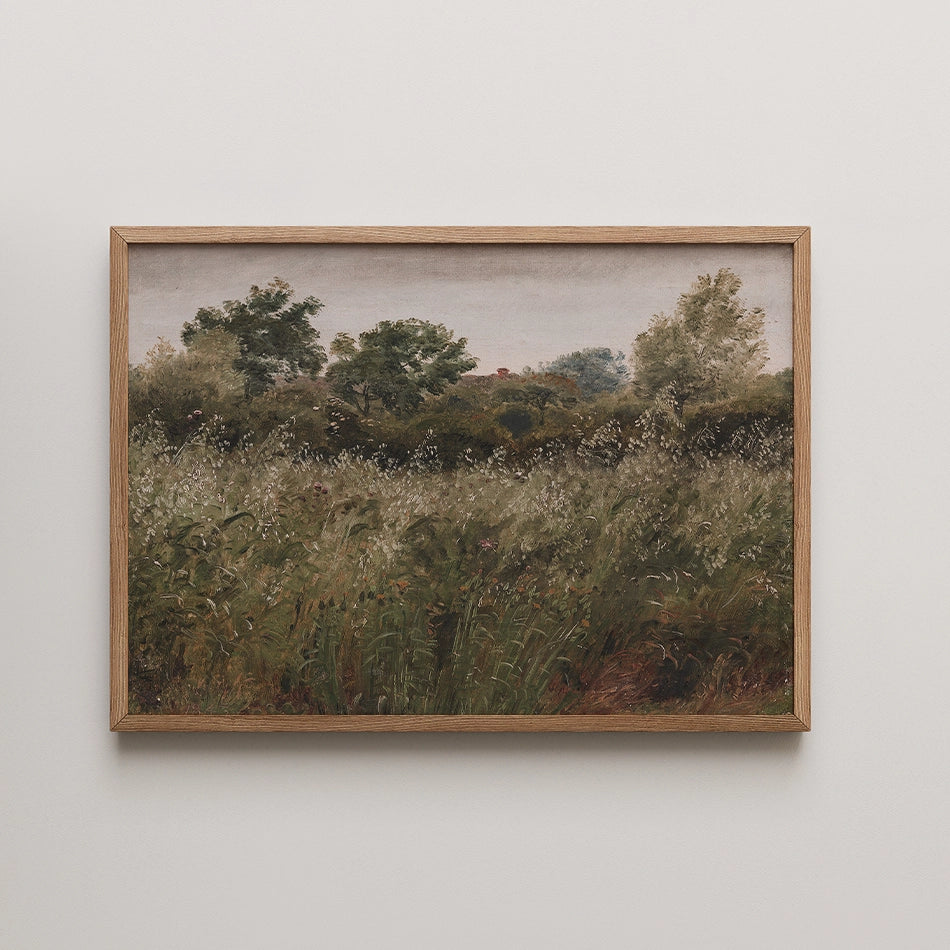 Framed painting of a lush field with tall grass and trees under a soft gray sky.