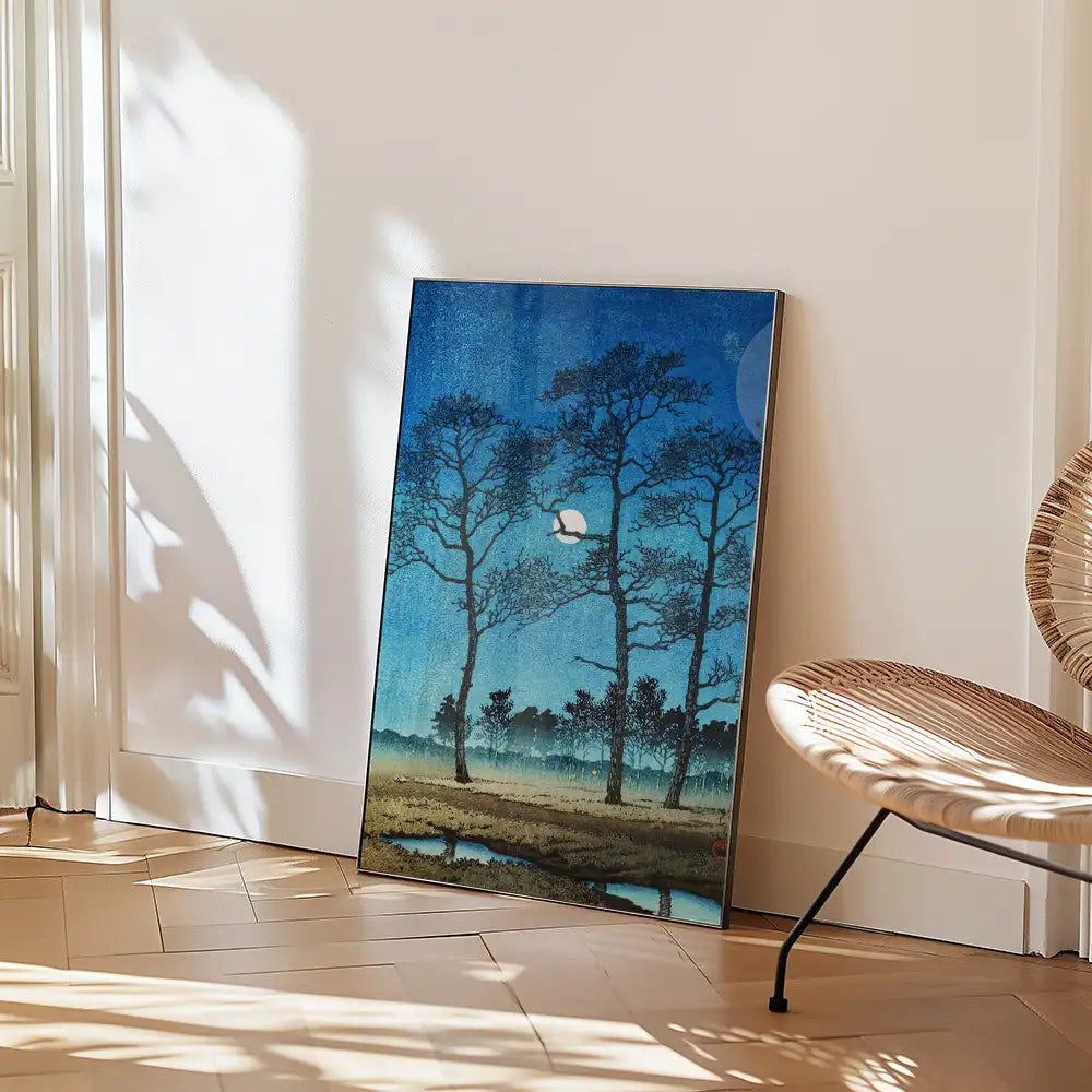 Painting of a serene landscape featuring tall, silhouetted trees against a deep blue night sky with a white moon and a hint of water below.