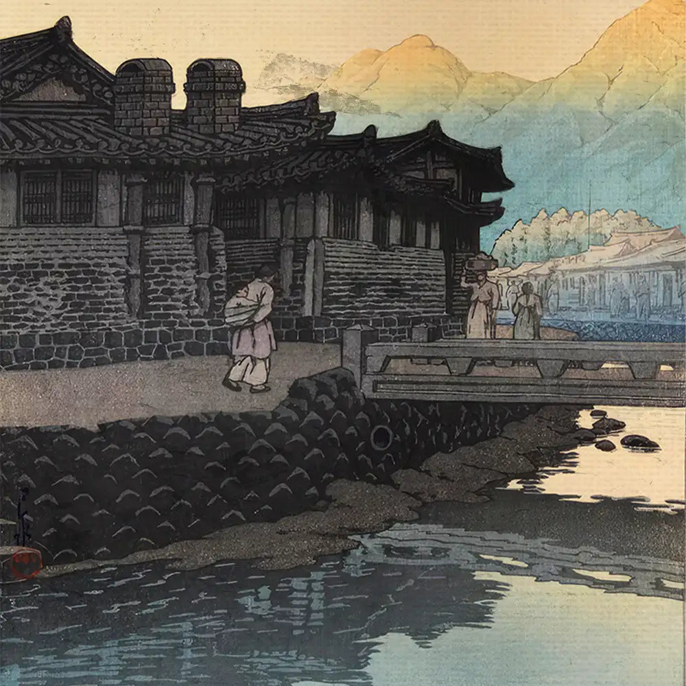 A serene landscape painting featuring traditional Asian architecture along a riverbank, with figures walking by and mountains in the background.