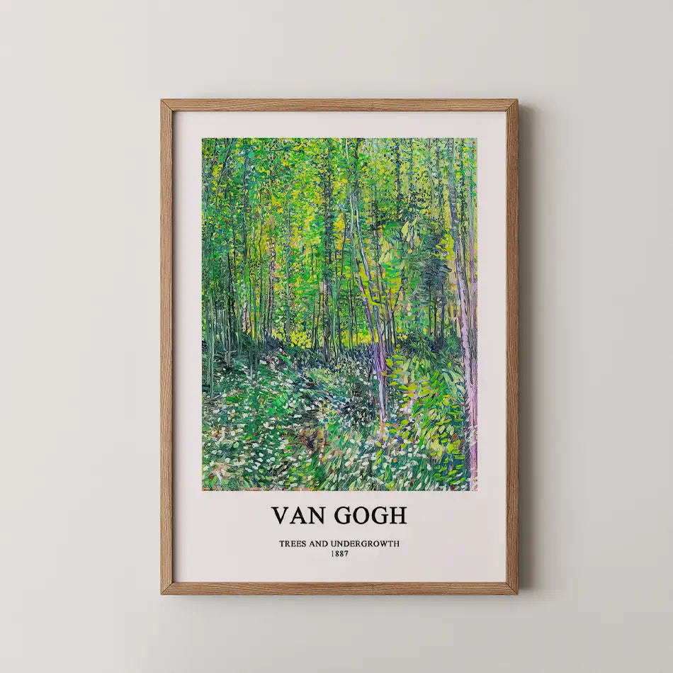 Framed poster of Van Gogh's "Trees and Undergrowth," featuring vibrant green foliage and a textured forest scene, with title and artist name displayed at the bottom.