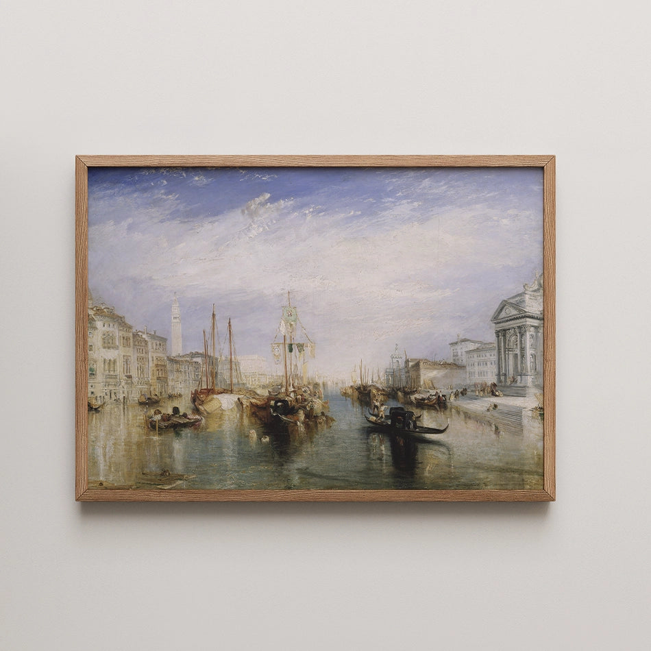 Painting of a serene canal scene featuring boats and historic buildings, framed in light wood.