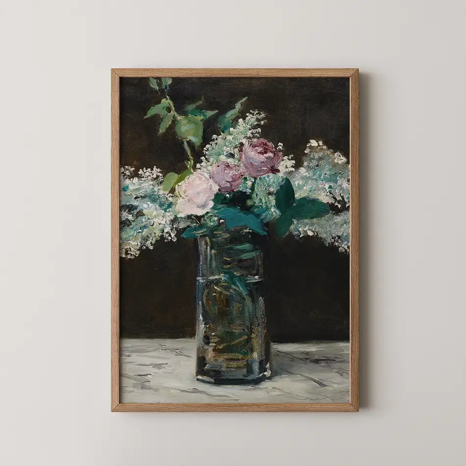 Painting of a bouquet of pink roses and greenery in a glass vase against a dark background, framed in light wood.