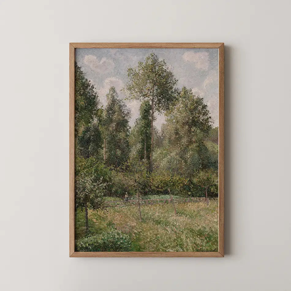 Framed landscape painting featuring lush green trees and a serene field under a cloudy sky.