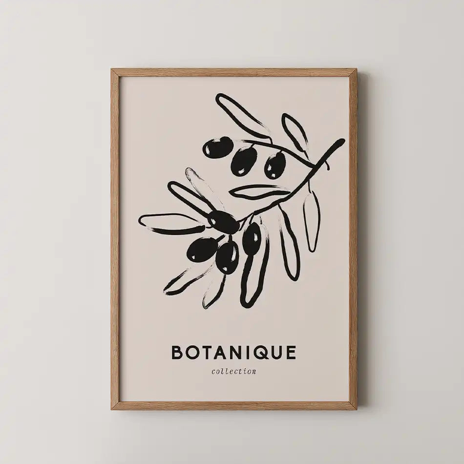 "Elegant botanical art print of an olive branch in black ink on a washed beige background from the Bohemian Collection, framed in wood."